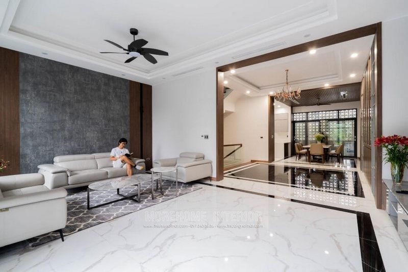 Bàn trà hiện đại với mặt đá nhân tạo vân mây được thiết kế để trang trí biệt thự tông chủ với màu trắng.